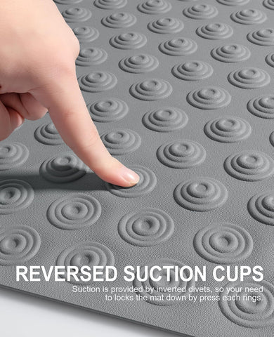 Reverse suction cups secure the mat in place underfoot