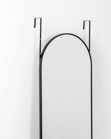 Otlsh arch mirror close-up shows slim black frame ideal for modern interiors.