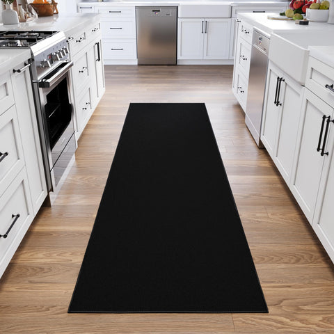 Ottomanson black runner adds a chic finishing touch to living rooms or wedding aisles.