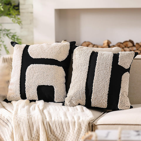 Oudain black and white tufted pillow cover closeup highlighting soft polyester texture.