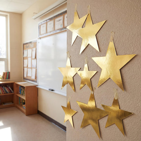 Outus gold star pendants decorate any party backdrop.