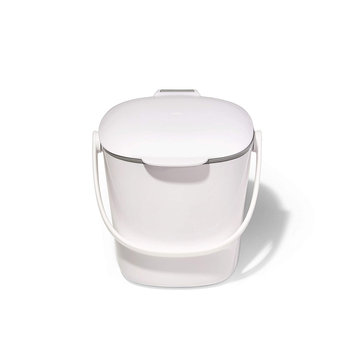 OXO Good Grips compost bin with lid open for quick disposal on the counter.