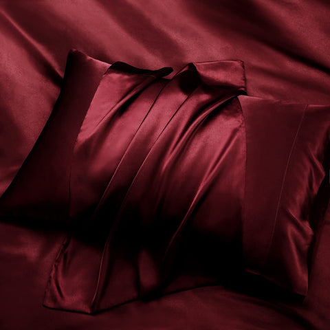 P Pothuiny stitching closeup on satin sheet showing craftsmanship