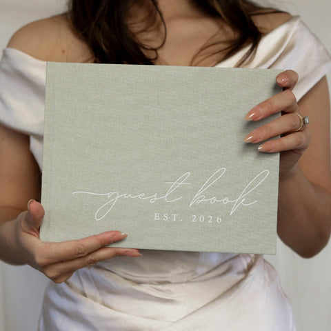Paige McRae guest book spine design adds durability for years of memories.
