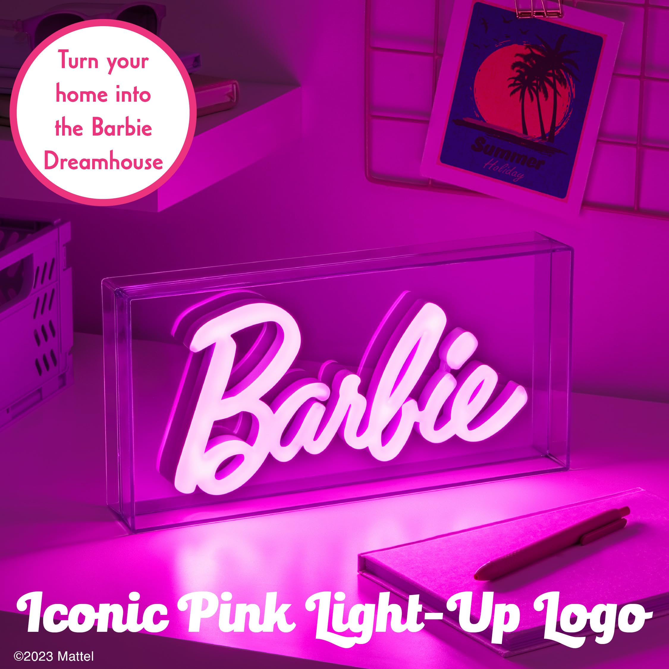 Paladone Barbie LED neon pink sign on desk creates stylish workspace ambiance.