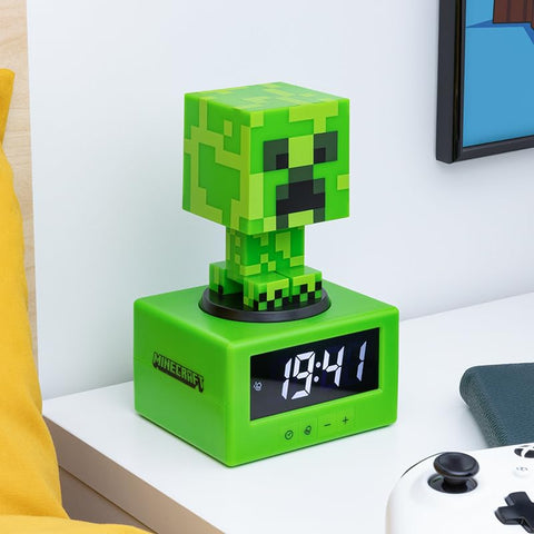 Paladone Minecraft Creeper alarm clock top view, easy snooze and light control.