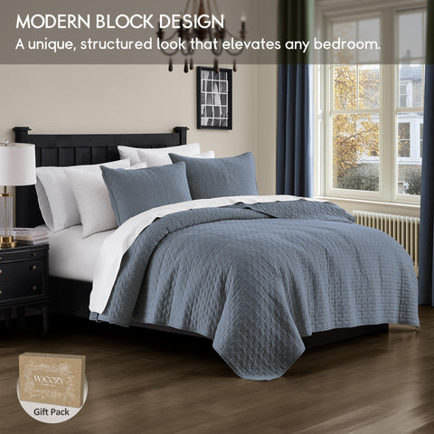 Palassio blue grey quilt on a Cal King bed showcases chic pattern and all-season softness.
