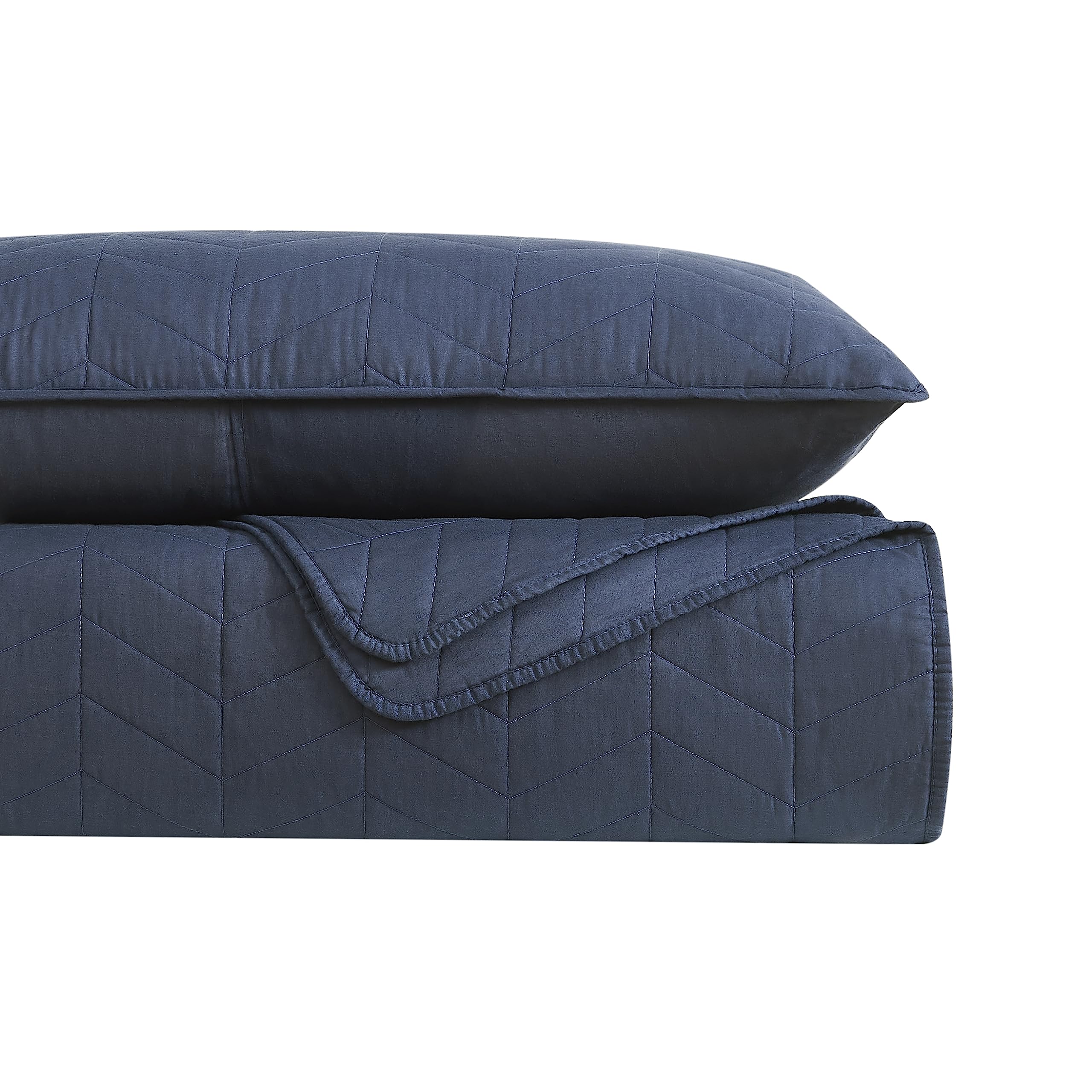 Palassio twin bed setup with navy quilt adds modern cozy look.