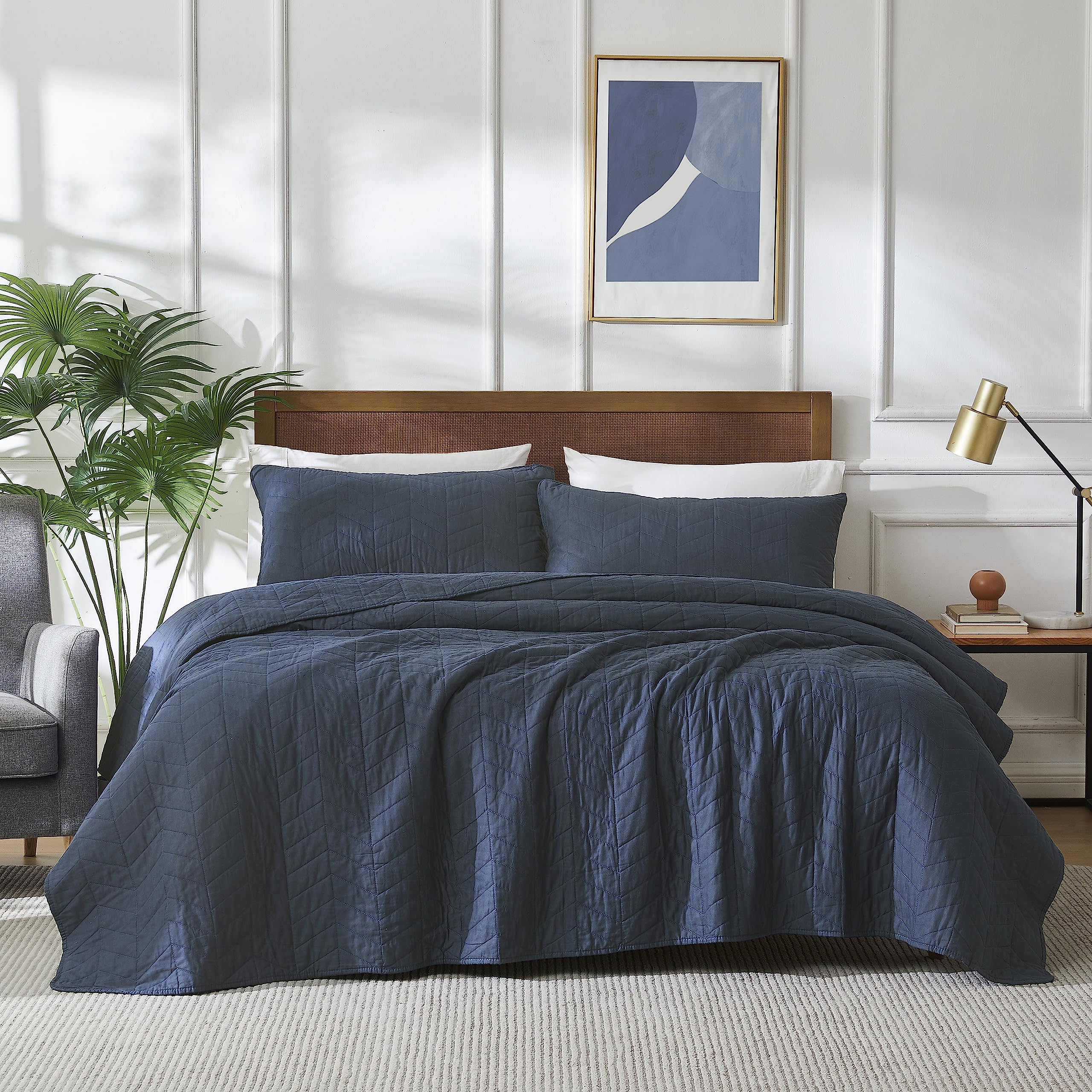 Palassio navy blue quilt twin coverlet shows smooth fabric for all-season warmth.