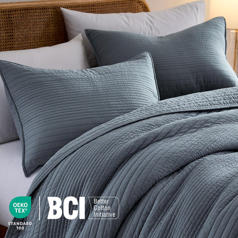 Palassio striped quilt on bed showcases versatile year-round use.