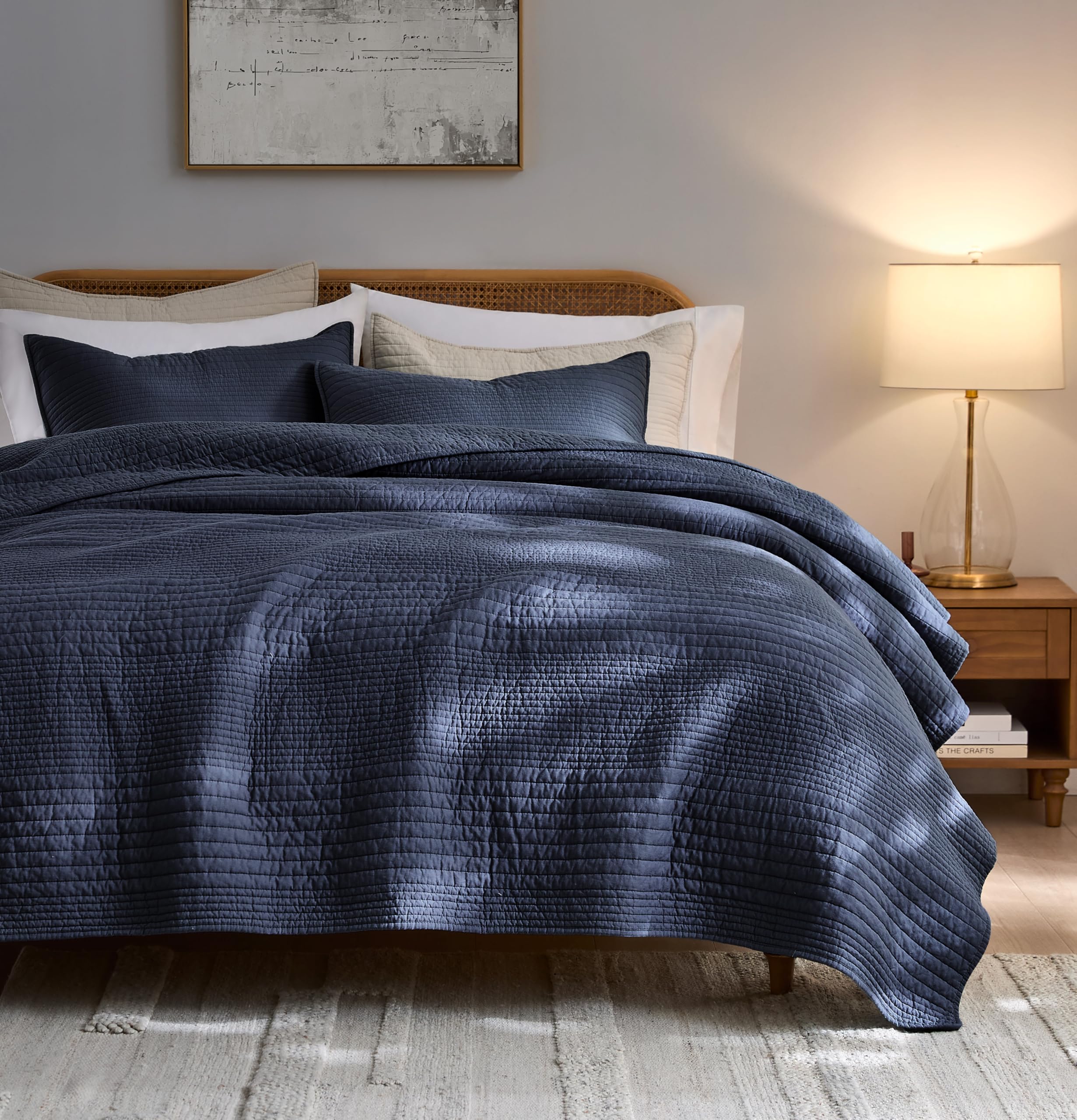 Palassio striped navy quilt on bed in queen size for all-season comfort