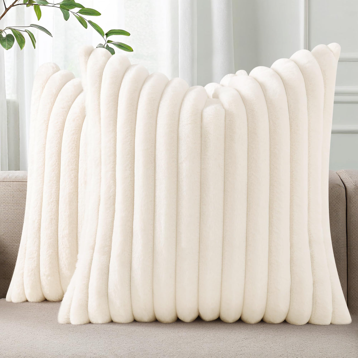 Pallene faux fur pillow cover in cream with plush texture for sofas.