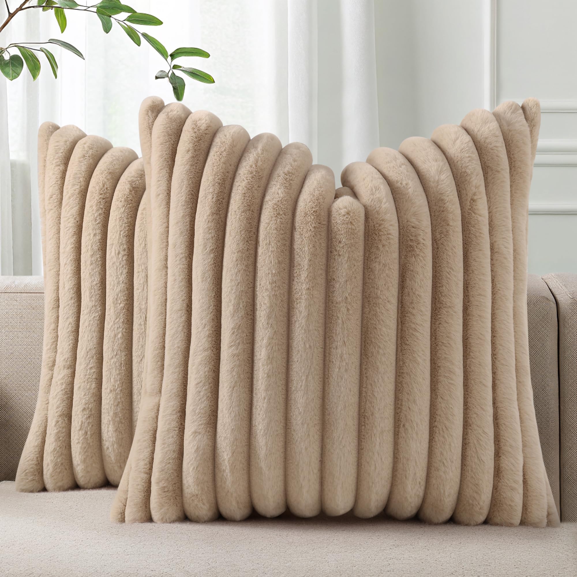 Pallene faux fur plush throw pillow cover with stripe side adds cozy sofa style.