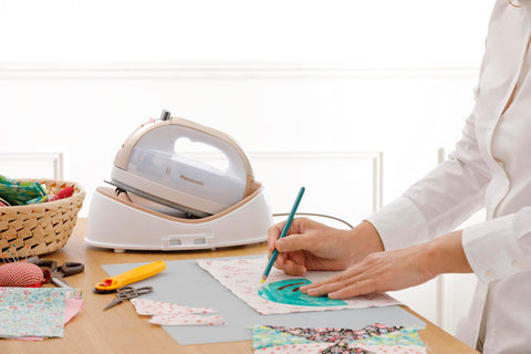 Cordless Panasonic 360 Freestyle iron in use for quick touch-ups.