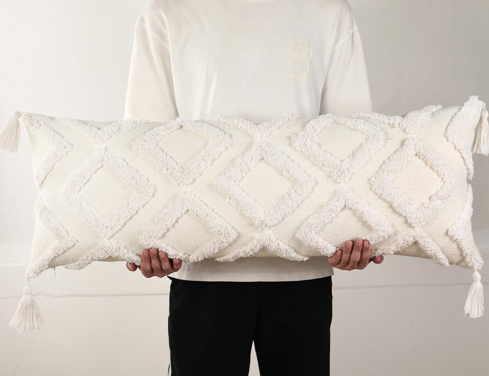 PANOD decorative long lumbar pillow cover in white chenille adds cozy texture to a sofa