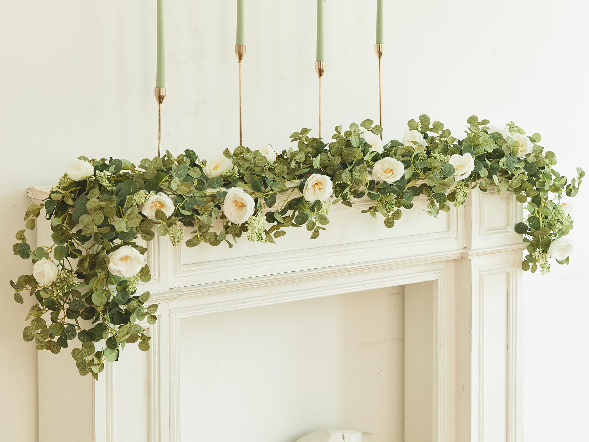 Party Joy eucalyptus garland on wedding arch for graceful ceremony backdrop.