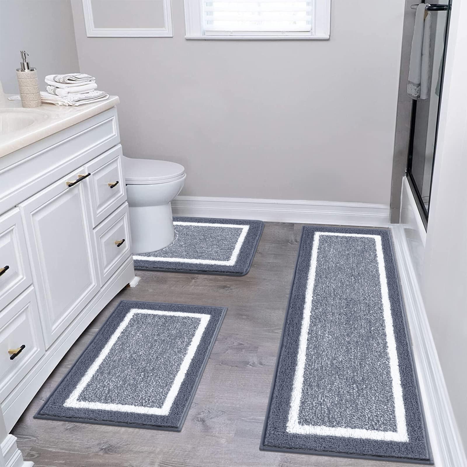 Pauwer bath rug set ultra soft microfiber texture for plush feet.