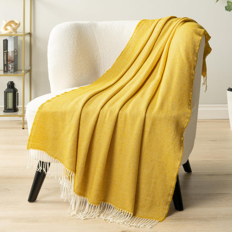 PAVILIA decorative yellow blanket draped over chair elevates room style