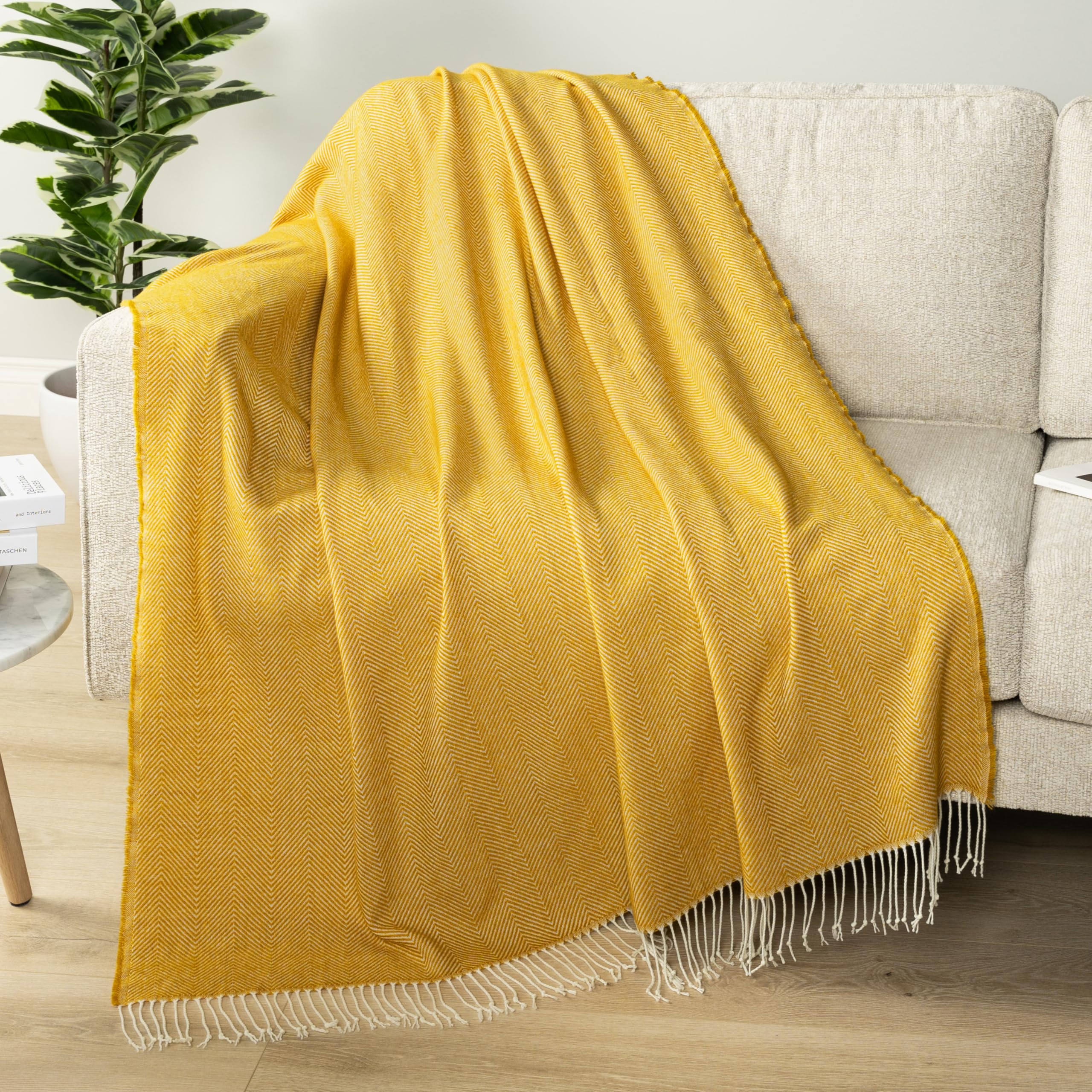 PAVILIA yellow throw with fringe tassel detail on sofa adds texture