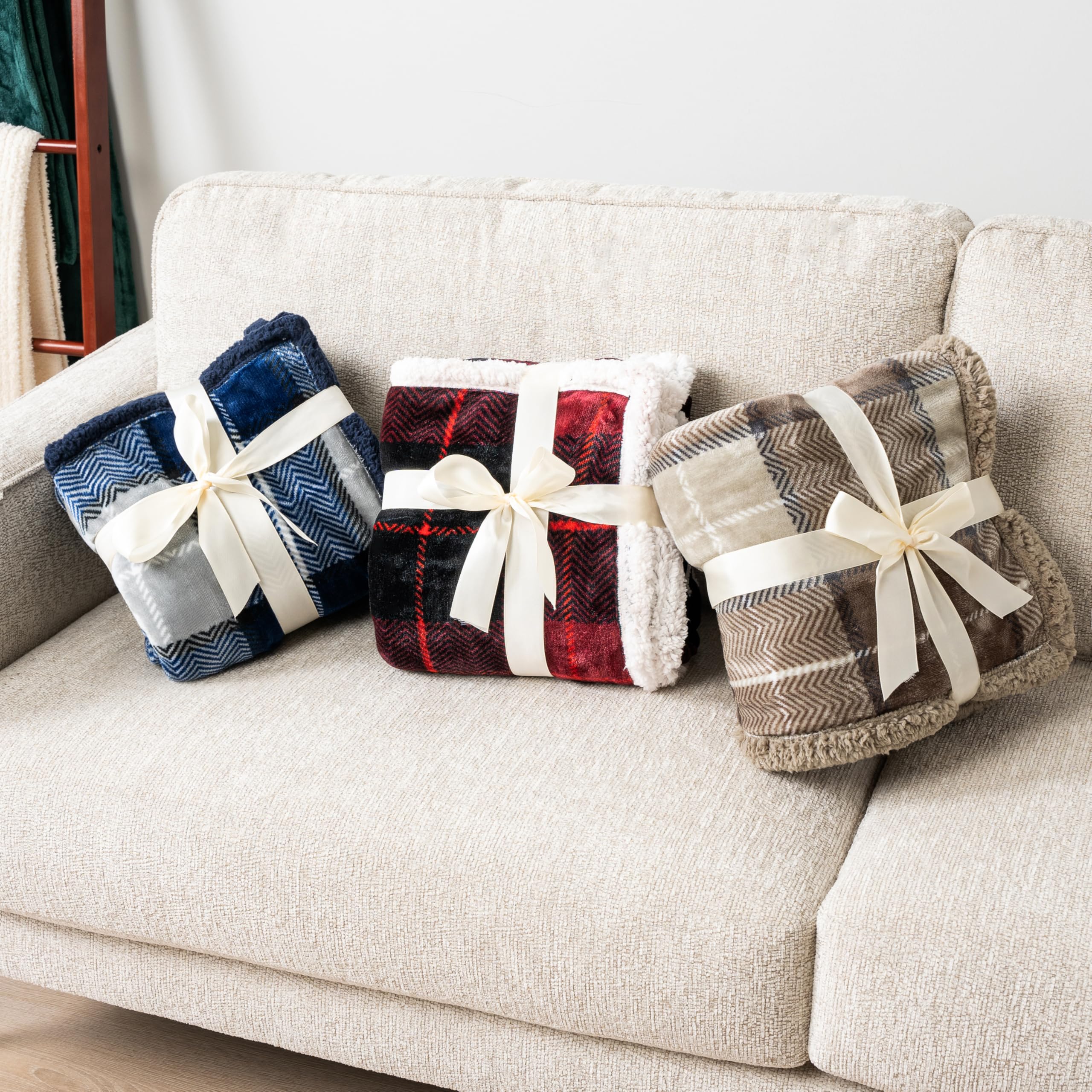 PAVILIA navy plaid decorative throw complements cabin or modern interiors.