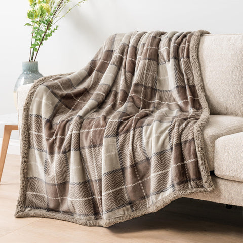 PAVILIA taupe plaid throw closeup highlighting plush fleece texture.