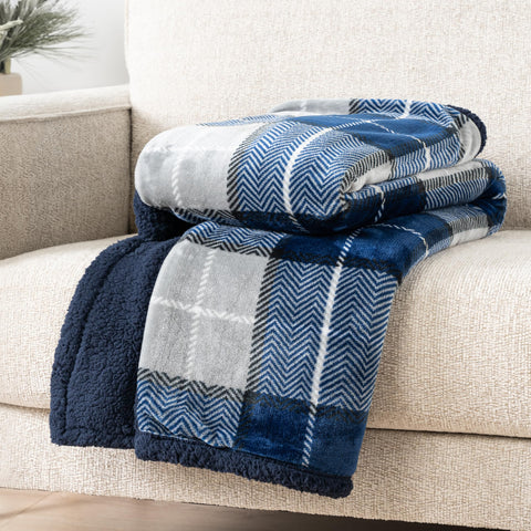 PAVILIA twin-size 60x80 sherpa blanket offers generous coverage.