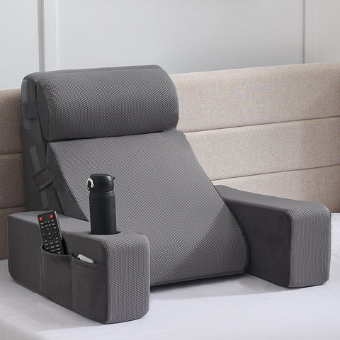 Paxato reading pillow with armrests provides stable bed reading support.