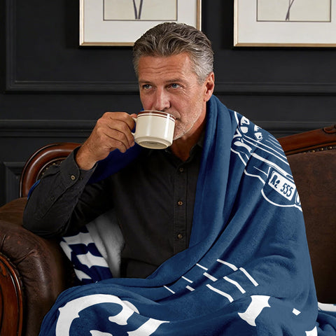 PAZISOL blanket draped over bed for cozy reading and naps.