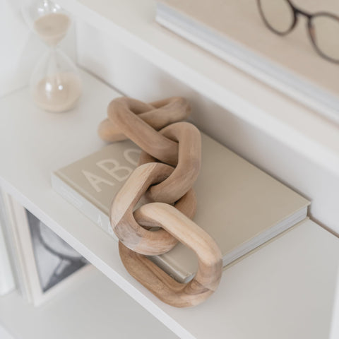 Peakoly acacia chain link decor atop a mantle with natural grain detail