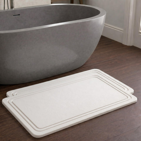 Pebble Nest stone bath mat with diatomite absorbs water quickly, keeping floors dry