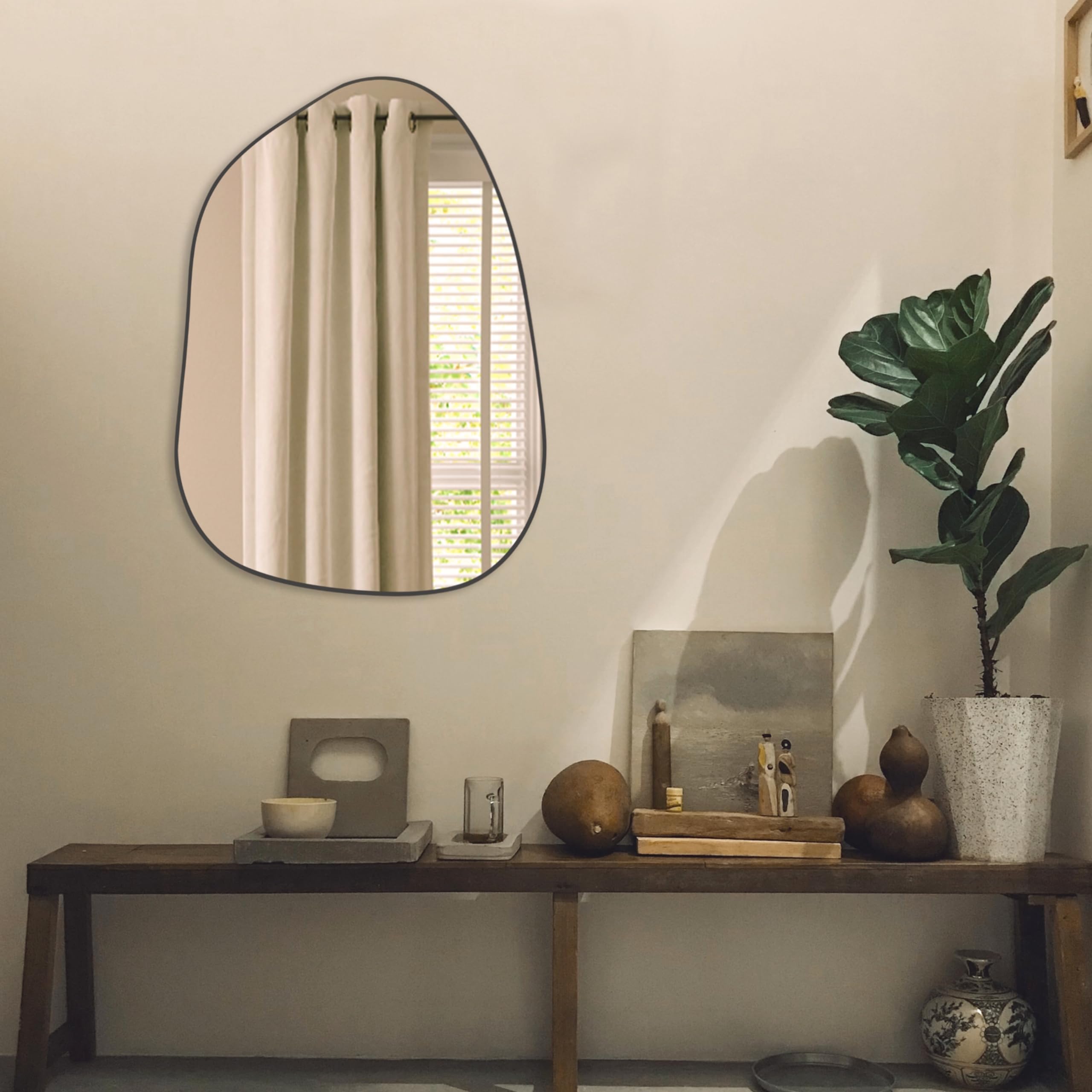 PERFNIQUE decorative wall mirror brightens spaces with stylish silhouette.