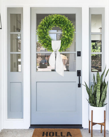Petalyn boxwood wreath outdoor-weatherproof design withstands sun and rain.