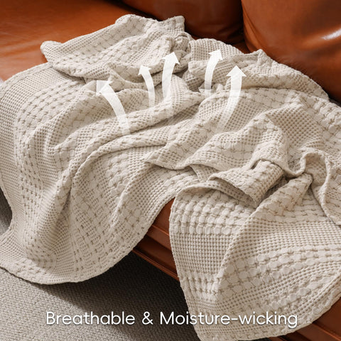 PHF waffle blanket laid on bedside for warm, calming ambiance.