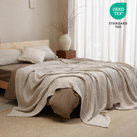 PHF king-size blanket shown as a travel-friendly warm layer.