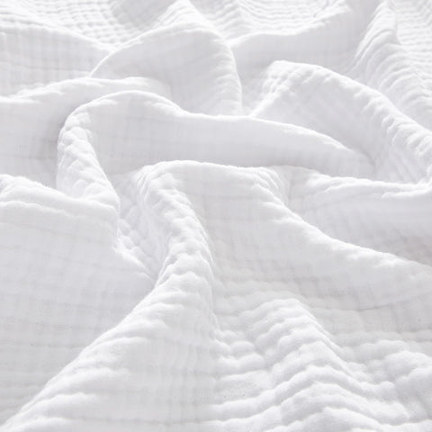 PHF muslin blanket king size on bed offering cozy coverage.