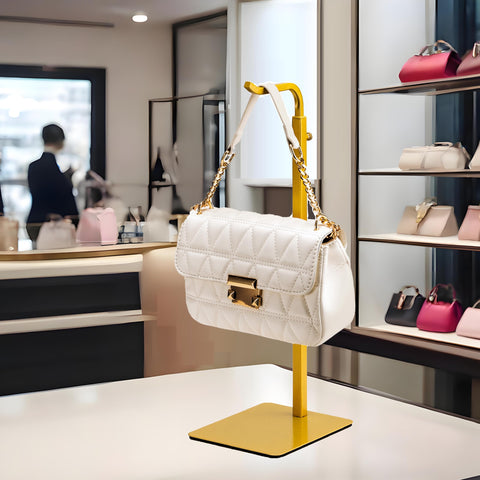 Pickpiff sturdy gold hanger stand resists fingerprints and supports bags up to six pounds.