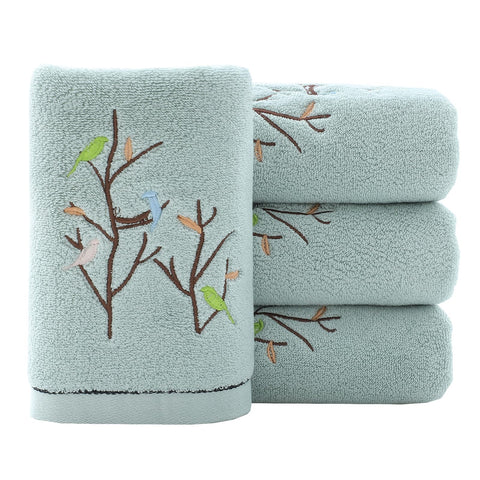 Pidada Bird Tree embroidery towels add decorative flair to your bathroom.