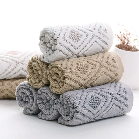 Pidada towels folded to reveal soft texture and plush feel.
