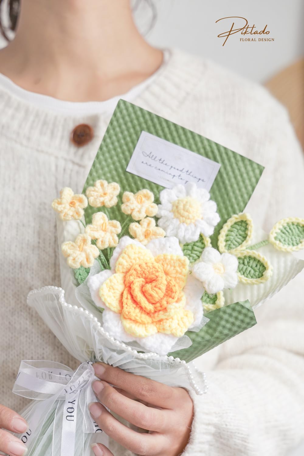 Piklado crochet flower bouquet closeup yellow petal highlights intricate craftsmanship and soft texture.