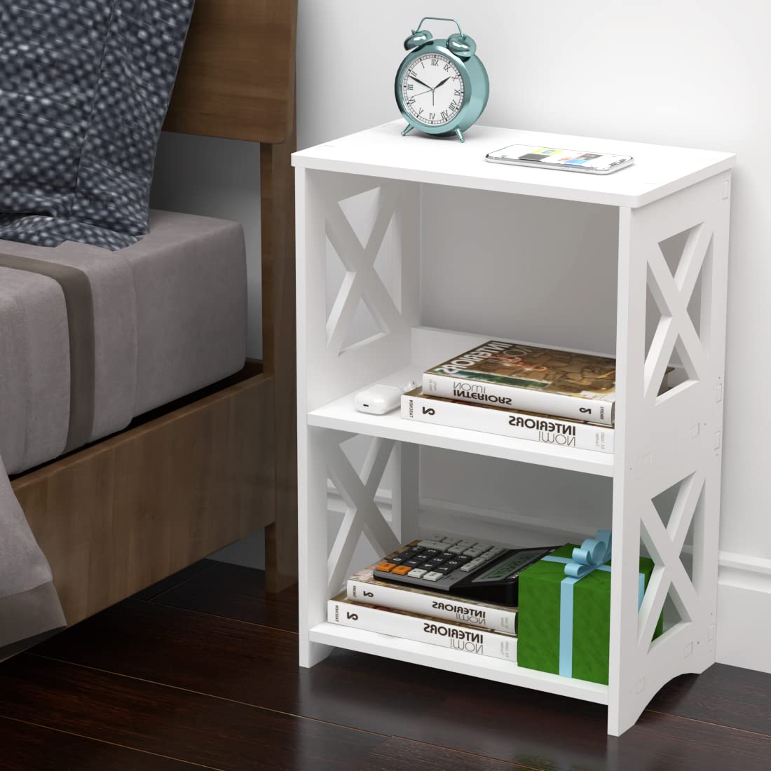 Pikpuk 3-tier storage white table displaying books and remotes neatly.
