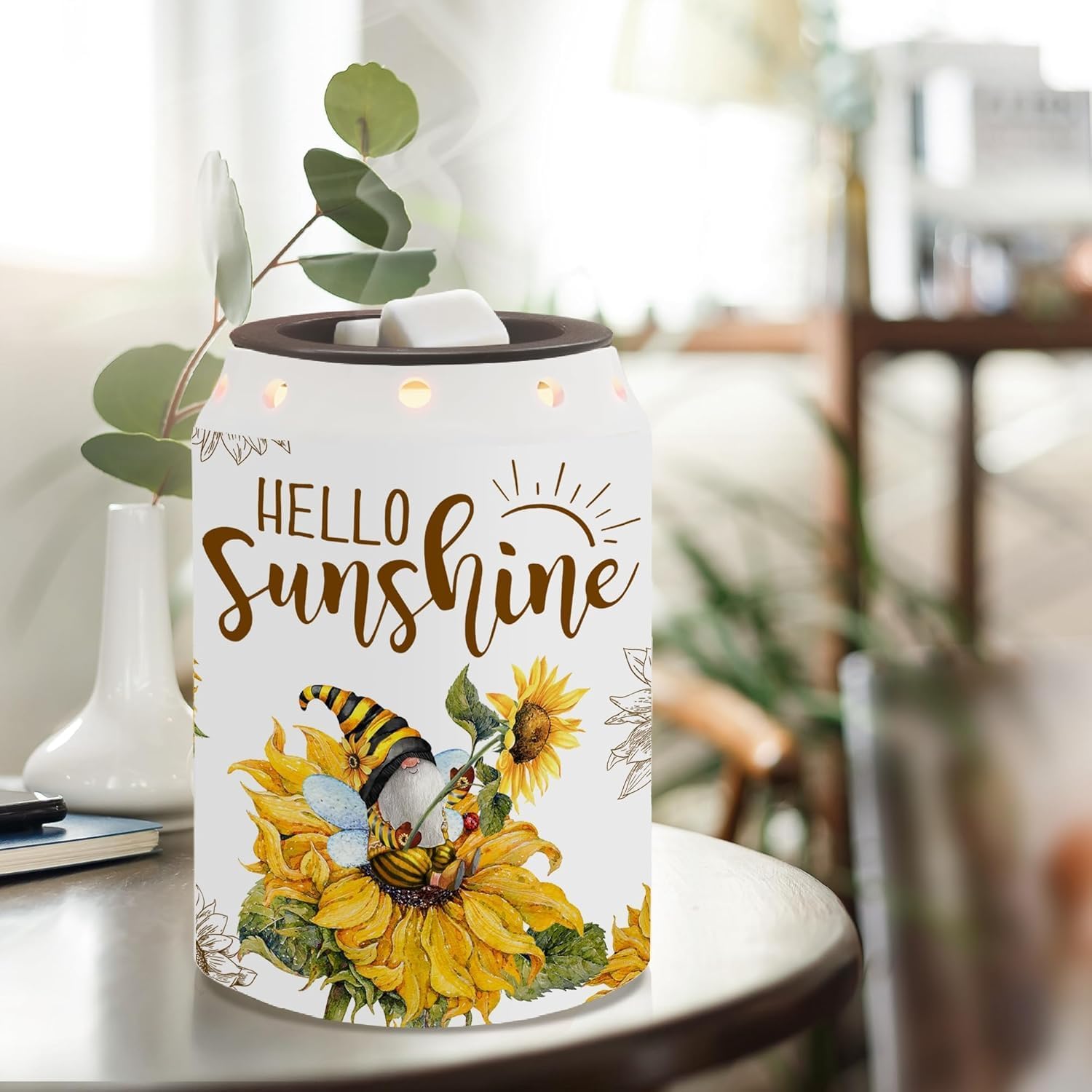 Pinata ceramic sunflower wax warmer with soft glow for cozy ambiance.