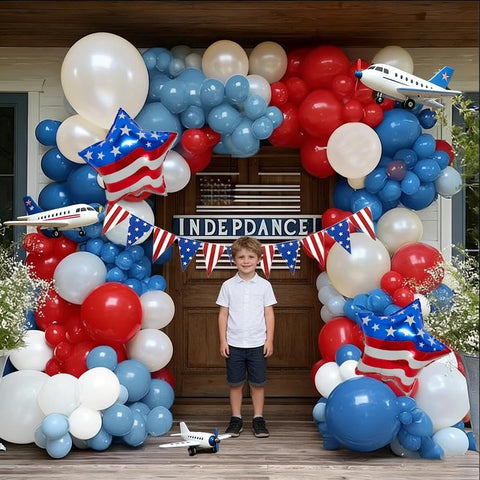 Pinbra dusty blue balloons soften the patriotic palette.