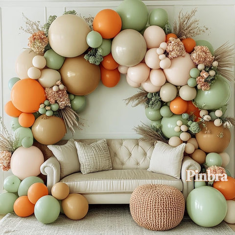 Pinbra dusty green and orange balloon garland kit for a chic neutral backdrop.