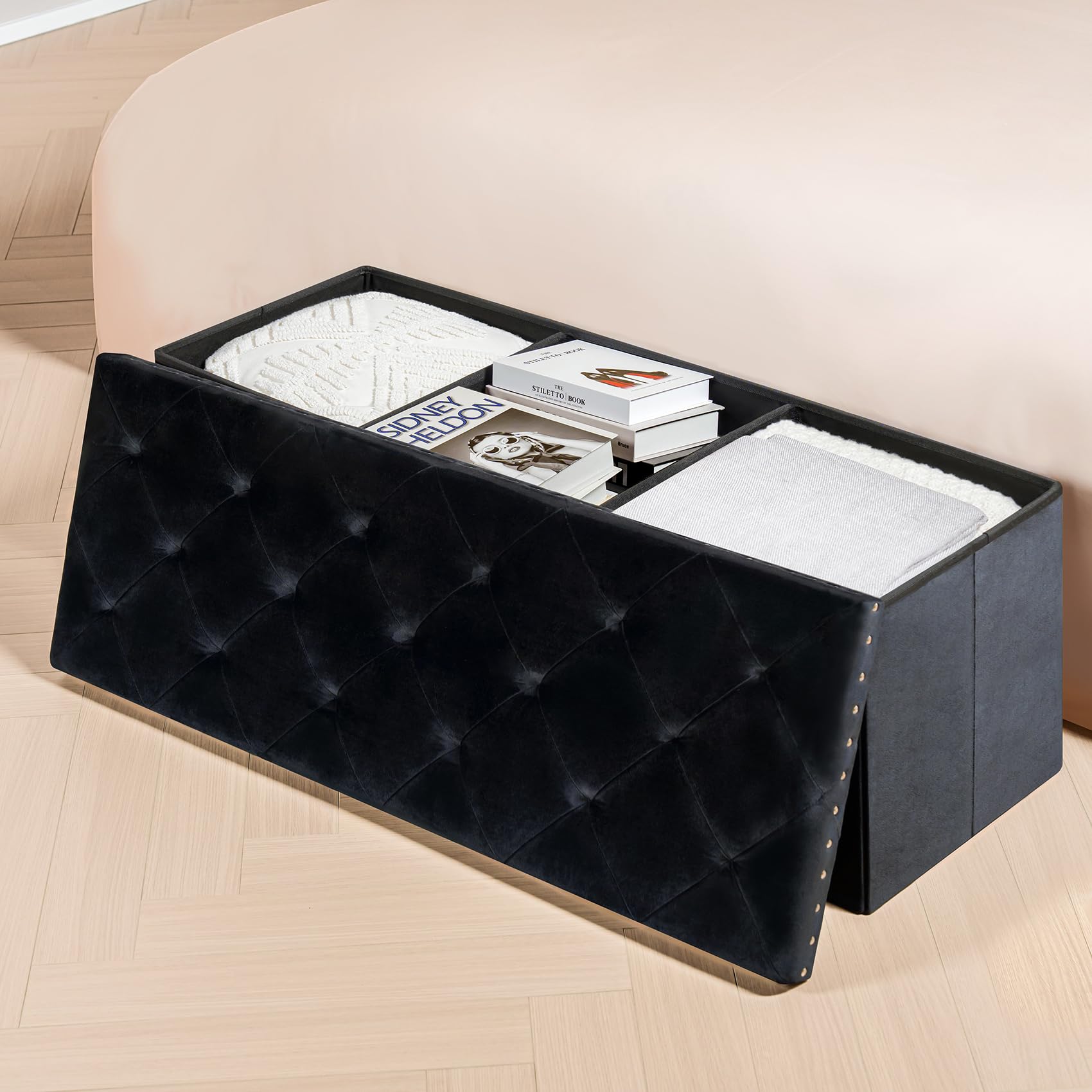 PINPLUS black velvet ottoman folds flat for easy space saving when not in use.