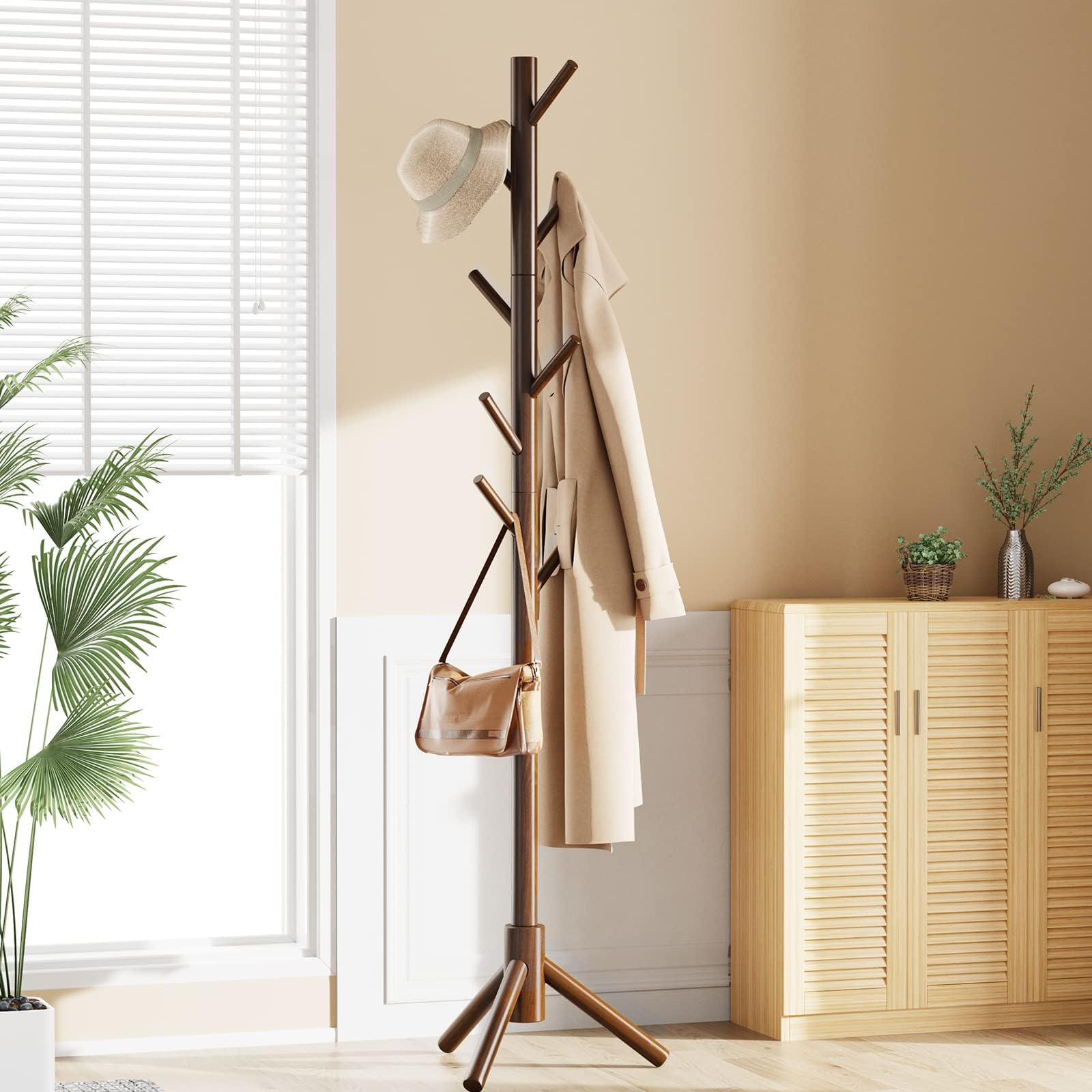 Pipishell coat tree placed in a bedroom corner beside desk.