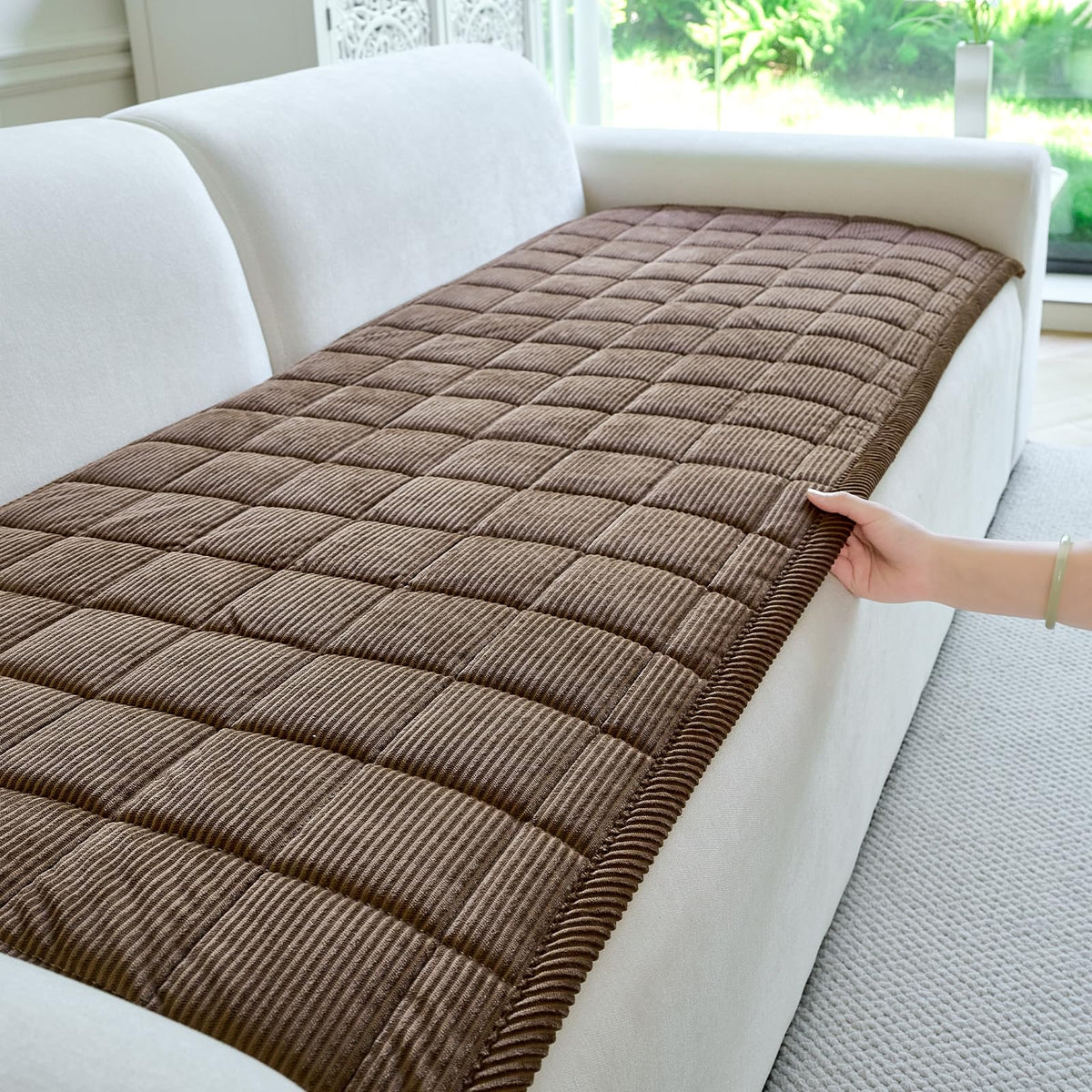 PJLZJFBY dog couch cover with non-slip backing protects furniture during active lounging.