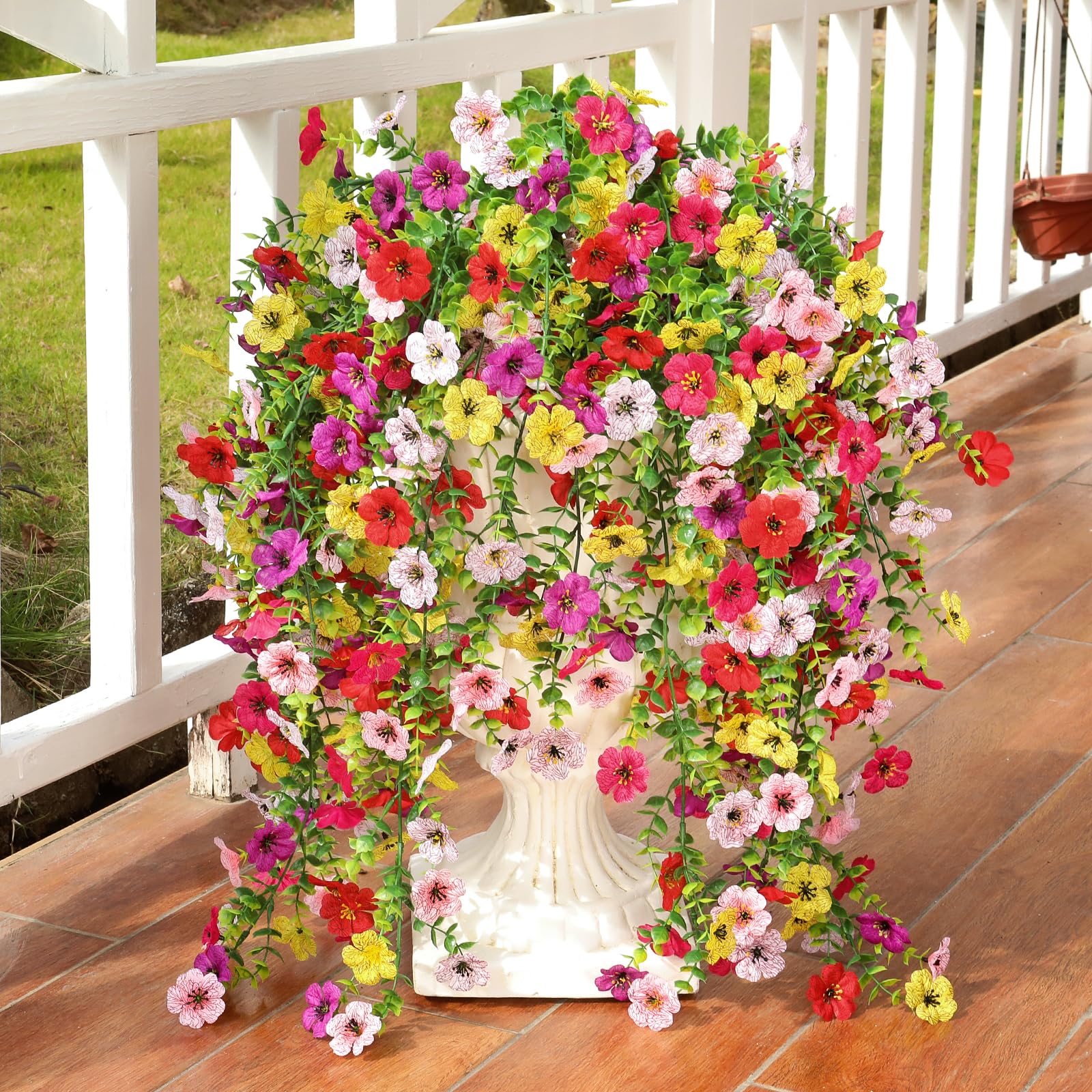 Playieer fake flowers with eucalyptus leaves add realistic texture to planters.