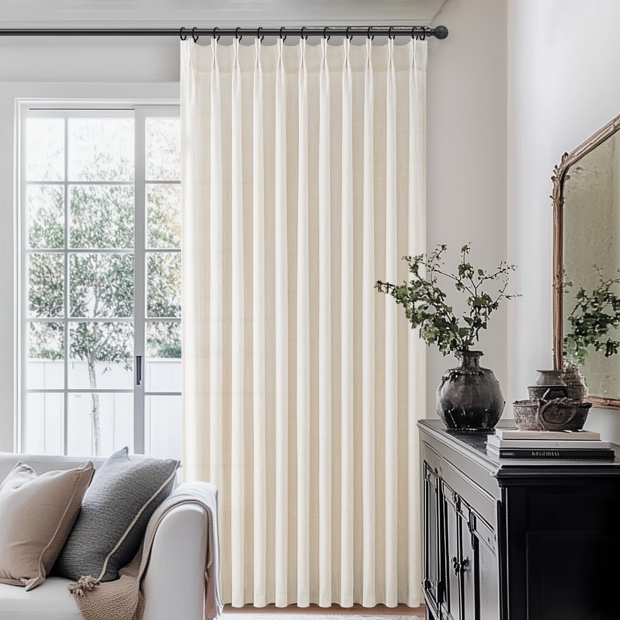 PleatedDrapes light-filtering linen curtains provide airy privacy in bedrooms.