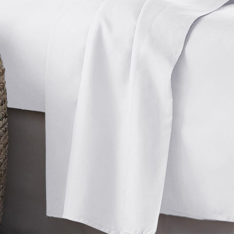 PLUSHY COMFORT white flat sheet highlighting soft, breathable feel for night comfort