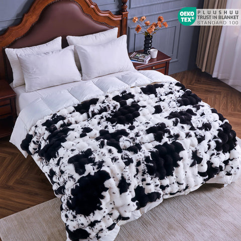 PLUUSHUU 60x50 inch blanket offers generous coverage for shared lounging.
